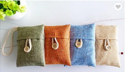 air purifying bamboo charcoal bags in 4 different colors. Green, orange, blue, and beige. 