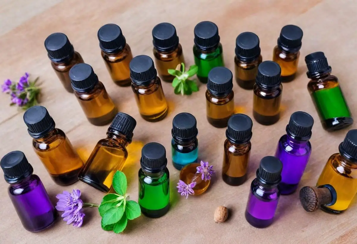 An assortment of different essential oil bottles with many different colors of oil.