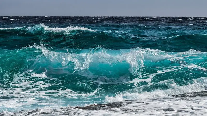 Deep blue and green waves in the ocean.
