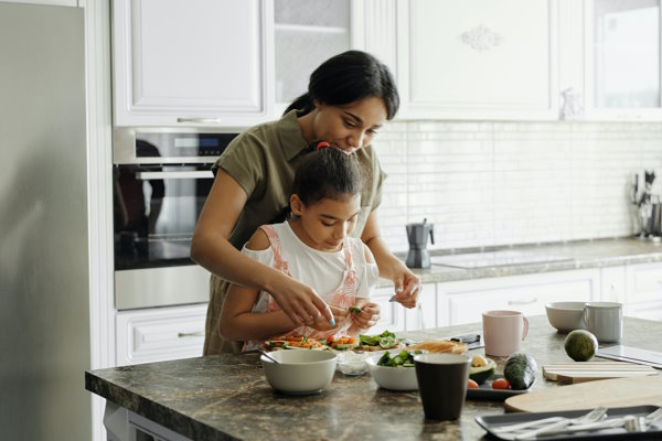 Woman and child cooking in the kitchen