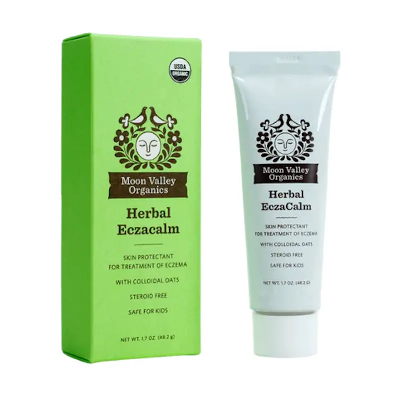 A white tube and green box containing Moon Valley Organics® Herbal EczaCalm skin protectant and moisturizer that is sterioid-free and safe for kids.