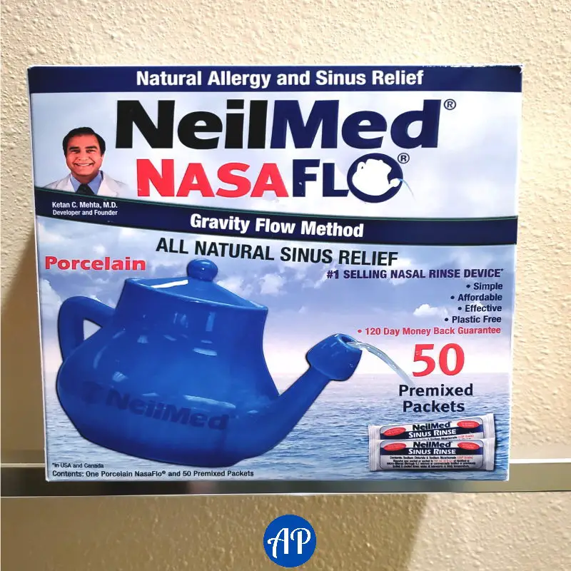 Box of the NeilMed Nasaflo rinse kit. Shows an image of a porcelain pot with 50 premixed saline packets. 