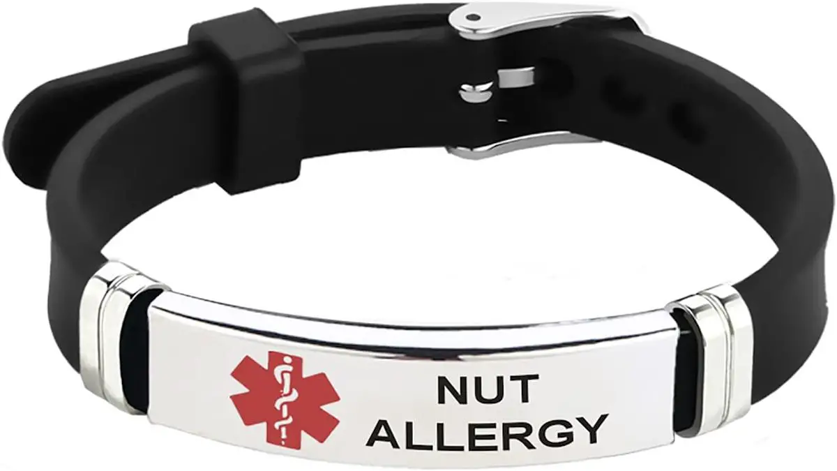 Medical alert allergy bracelet that states "nut allergy" with a black band.