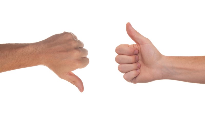 An image with a thumbs down next to another hand giving a thumbs up.