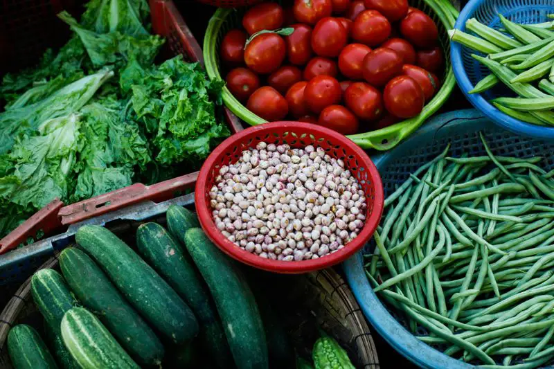 An array of high-vitamin content vegetables like green beans and cucumbers.