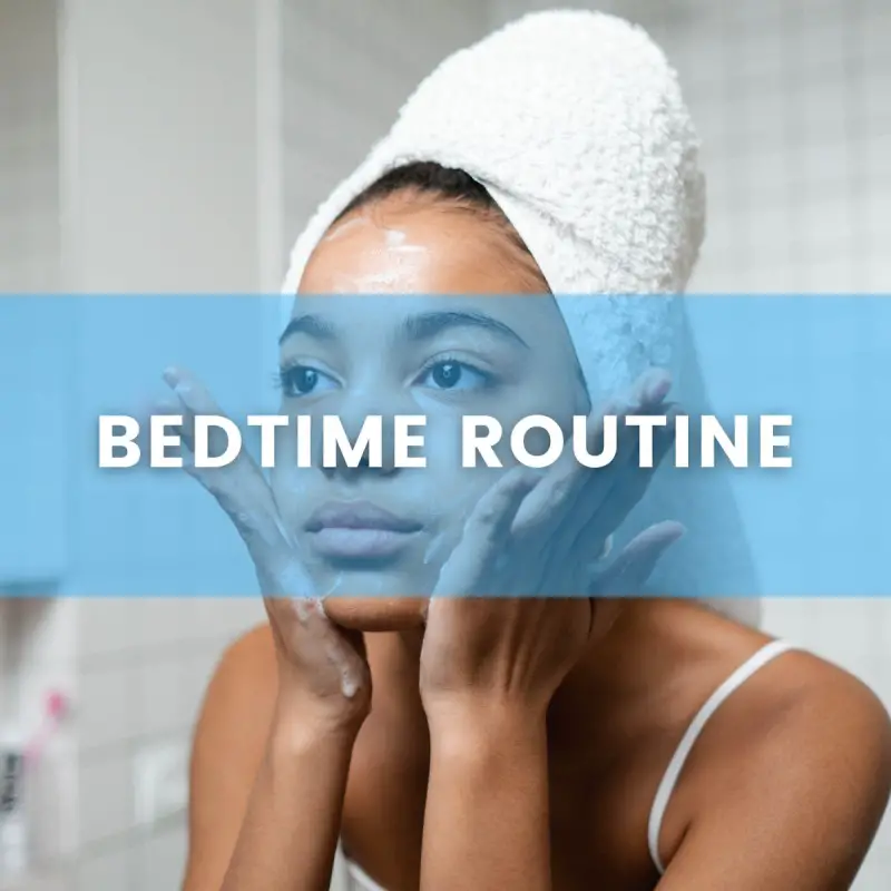 Woman who is washing her face with soap and has a towel on her head. Text over image says "Bedtime Routine"