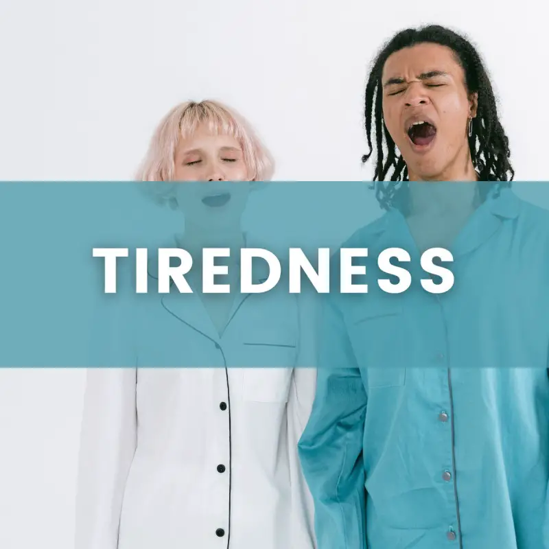 A male and a female in pajamas yawning, with a text sign that states "tiredness"